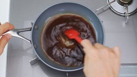 Mixing Mitarashi Dango Sauce ingredients together in a pan.