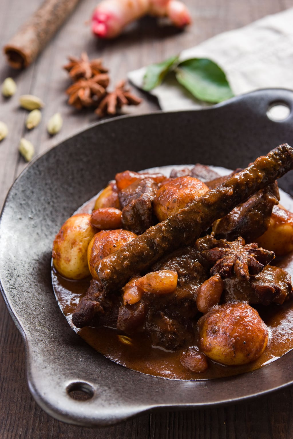 Loaded with tender beef, potatoes and peanuts, in a savory, spicey, sweet and tangy curry, Massaman is a Thai dish with Persian roots that perfectly melds Thai aromatics like lemongrass and galangal with Persian spices like cardamom, cloves and star anise.