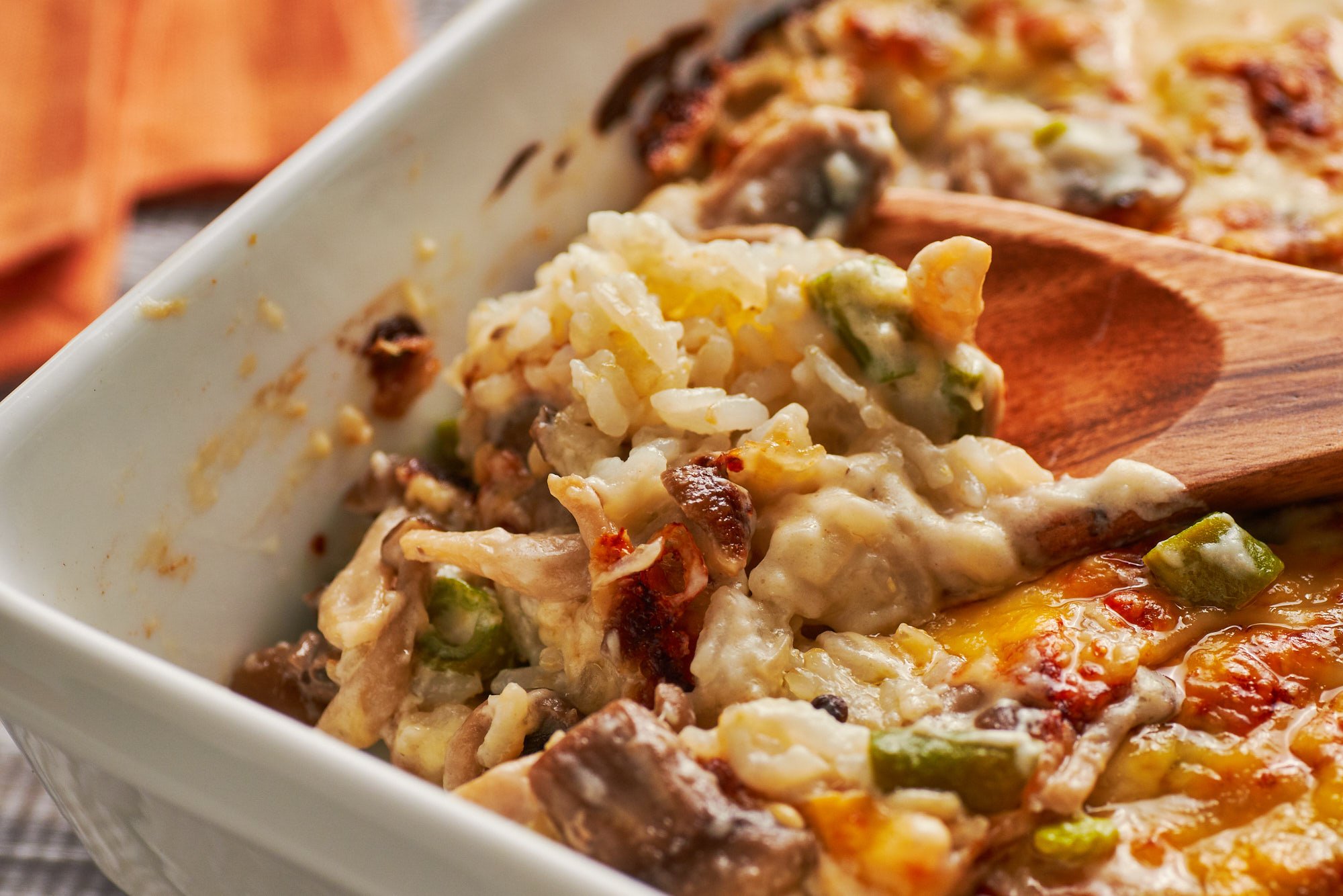 Under the bubbling sea of creamy mushroom and green bean bechmel and cheese lies a hearty bed of rice.