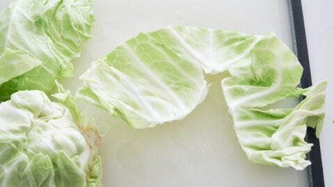 Remove the stem of cabbage to make coleslaw.