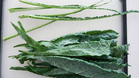 Lacinato kale with the center rib removed for making coleslaw salad.