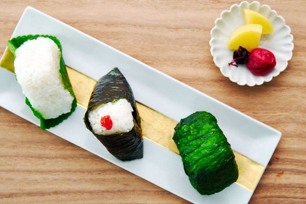 Three styles of Japanese Rice Ball: Tuna Mayo Onigiri, Umeboshi Onigiri, and Maze Gohan Onigiri.