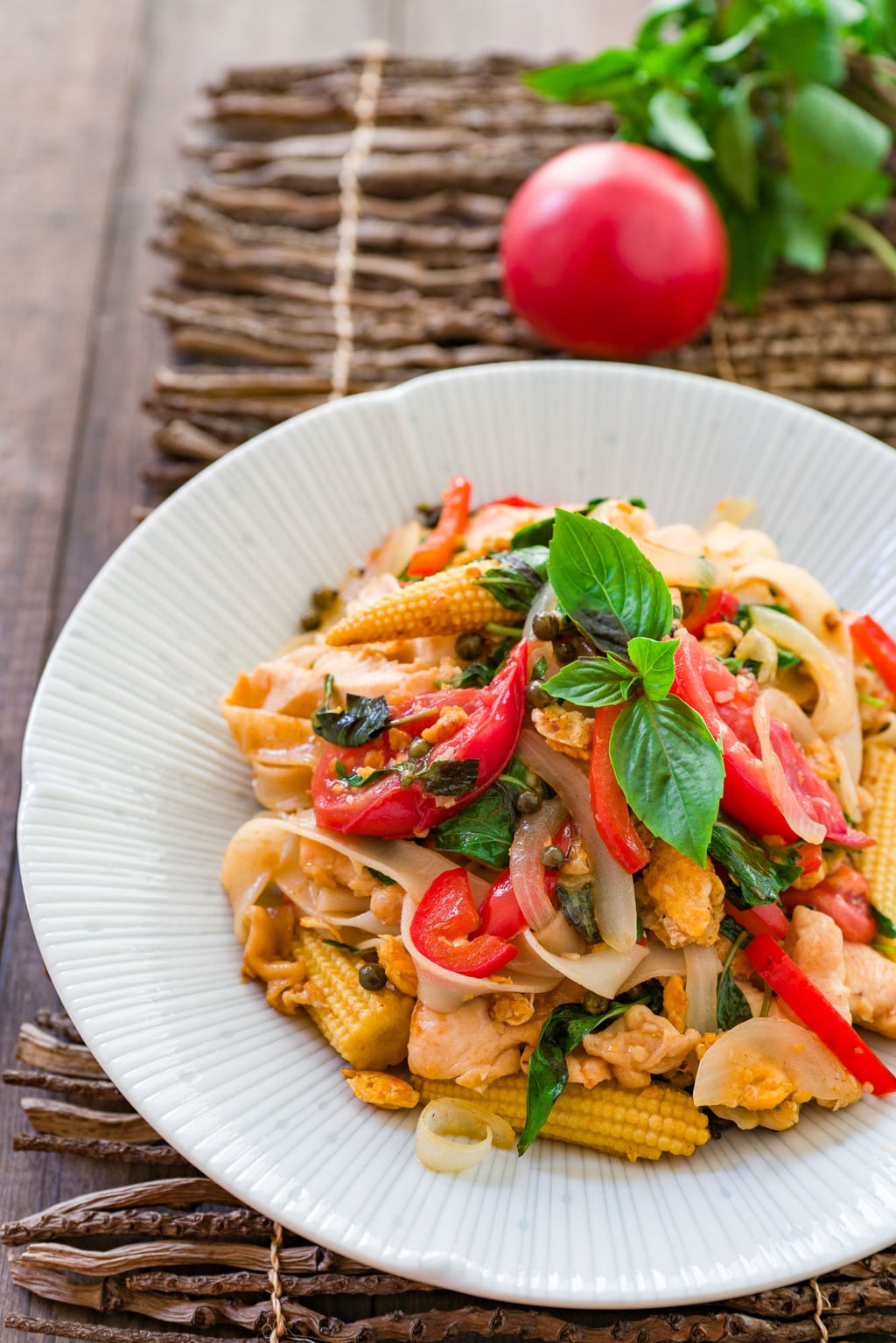 Pad Kee Mao, or "fried drunkard" is a delightfully flavorful Thai noodle dish loaded with a random assortment of vegetables and protein, perfect for a quick weeknight meal.