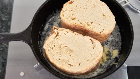 Pan fry the Pain Perdu in butter first before putting the pan in the oven.