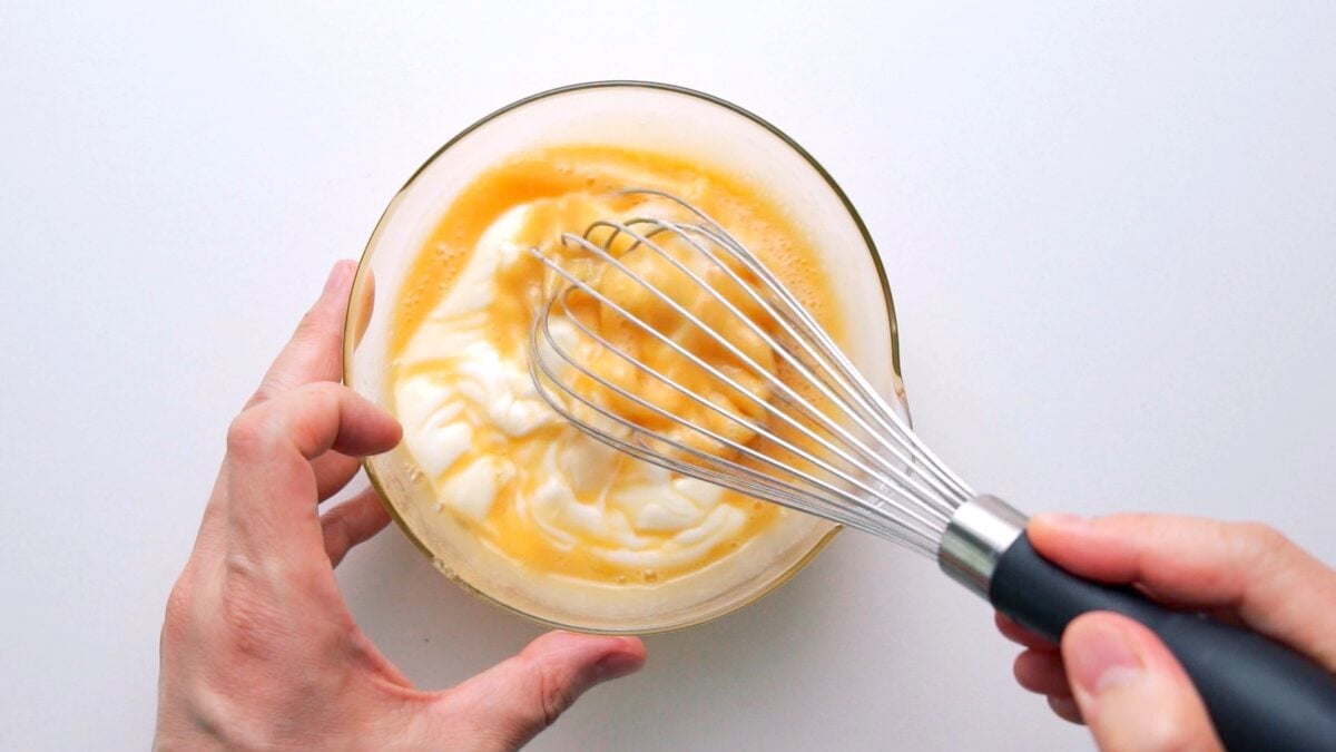 Wet ingredients for pancake cereal being mixed together.