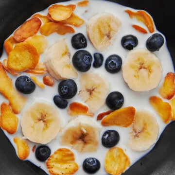 Pancake Cereal with blueberries, bananas, and milk.