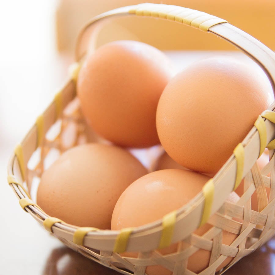 A basket of farm-fresh eggs are perfect for making boiled eggs when you know the right techniques.