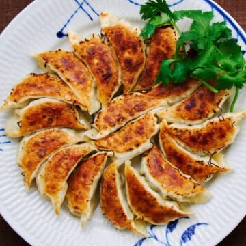 These Japanese gyoza highlight the tantalizing interplay between the crisp pan-fried wrapper and blissfully juicy pork and cabbage filling.