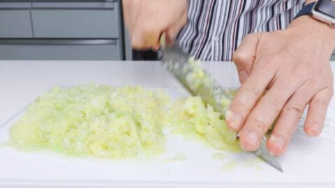 Mincing boiled cabbage for making Japanese gyoza dumplings.