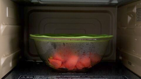 Carrots and potatoes microwaved in a glass bowl to speed up the cook time for Nikujaga.