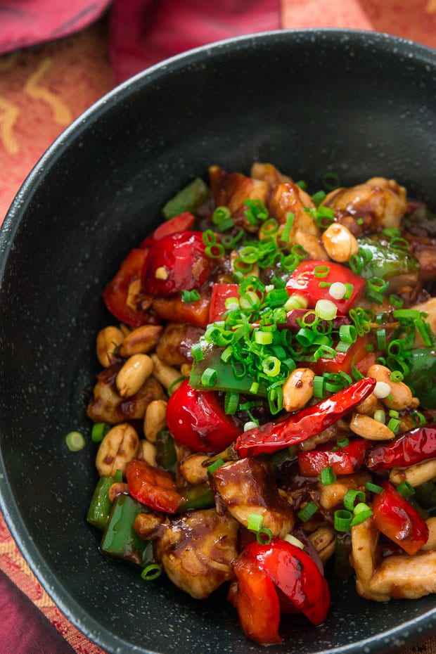 A dish of Kung Pao Chicken with chilies and peanuts.