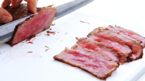 Slicing rare wagyu roast beef.