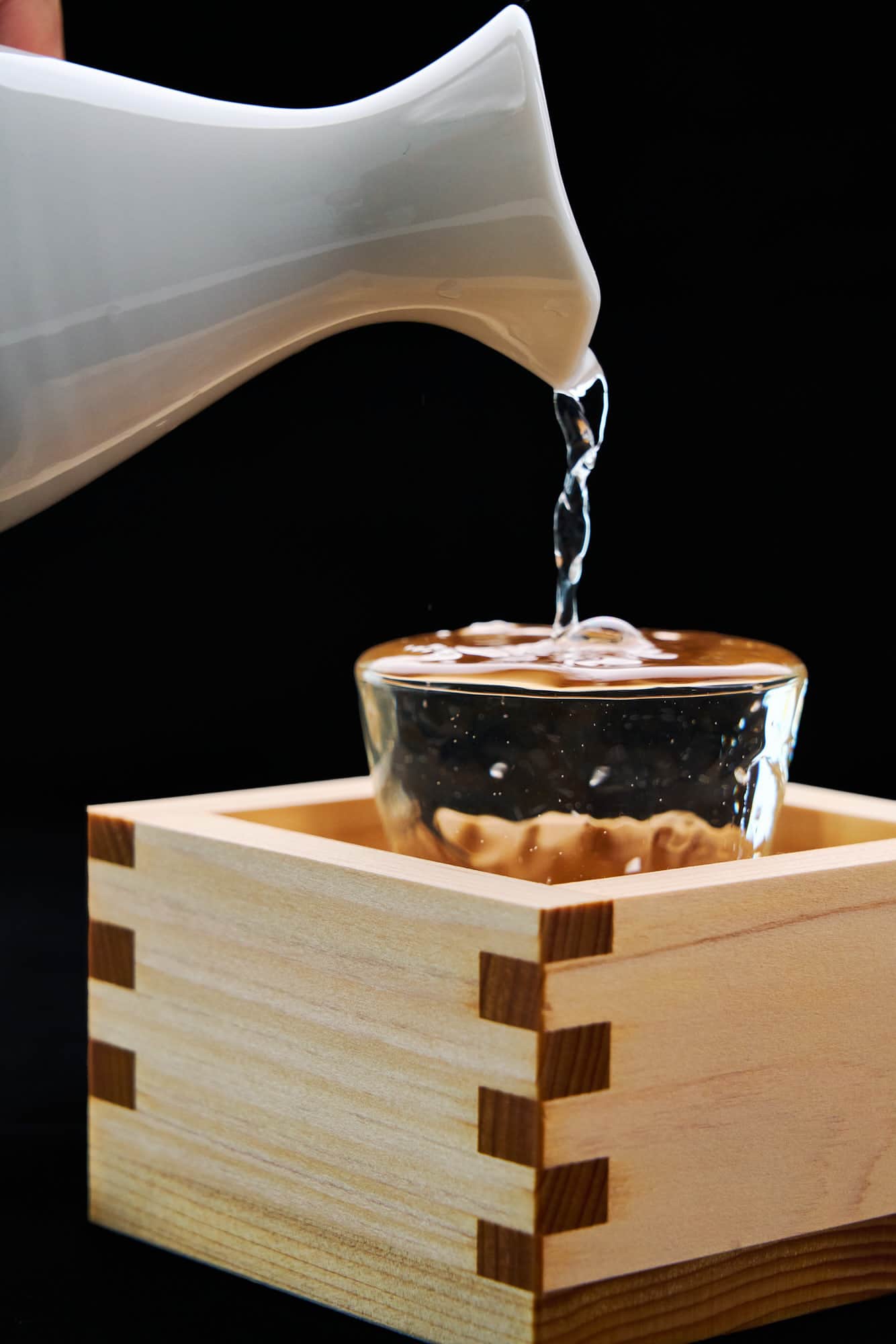 Morikoboshi overflowing from a glass. Sake isn't just a beverage it's an vital ingredient in Japanese cuisine.