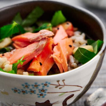 Tea rice or Ochazuke, is a classic Japanese comfort food, and this one is topped with salted salmon and rice crackers.