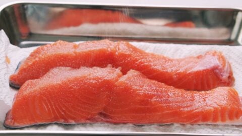 Salt curing salmon.