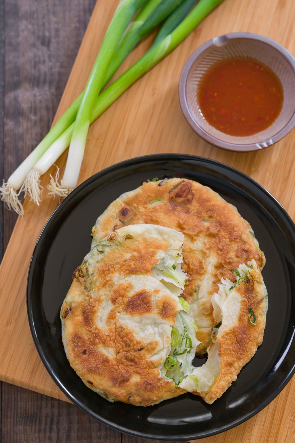 A great scallion pancake is crunchy on the outside and tender and a bit chewy on the inside. Loaded with scallions and redolent of toasted sesame oil, it makes for a great appetizer, snack, or meal on the go.