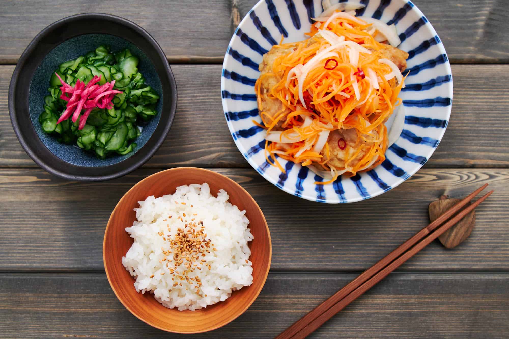 Overhead shot of a Japanese meal spread, beautifully showcasing the versatility of homemade sushi vinegar in various dishes.