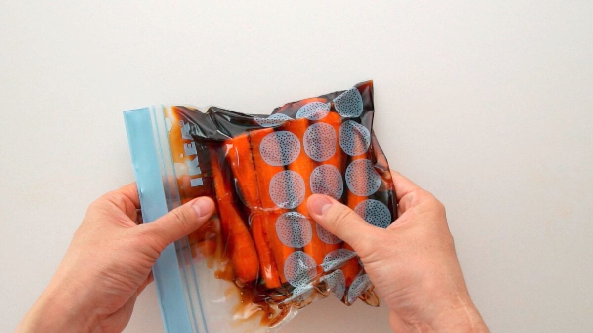 Submerging carrots in a soy sauce brine to make Shoyuzuke Pickles.