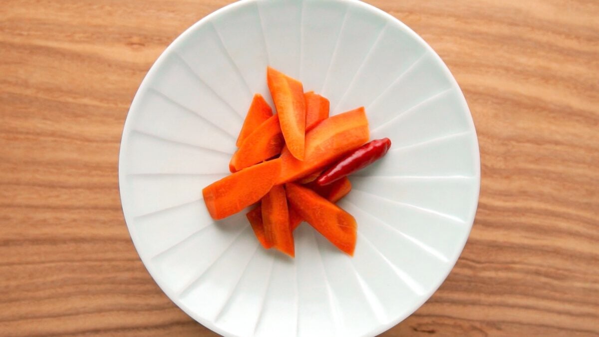 A plate of carrot shoyuzuke, a Japanese pickle brined with soy sauce.