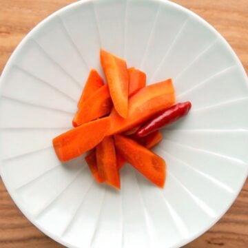 A plate of carrot shoyuzuke, a Japanese pickle brined with soy sauce.