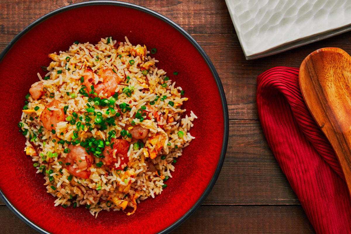 The best shrimp and egg fried rice in a red ceramic bowl.