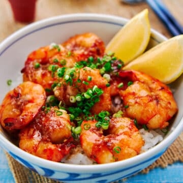 Easy shrimp rice bowl with plump juicy shrimp glazed with a decadent garlic butter-soy sauce on a bed of rice.