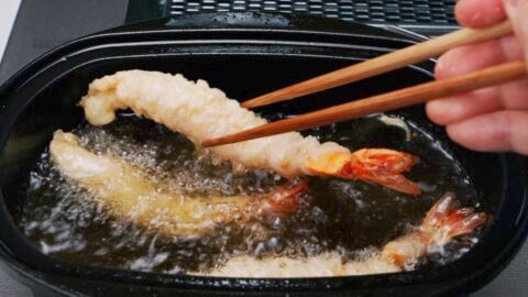 Frying tempura shrimp.