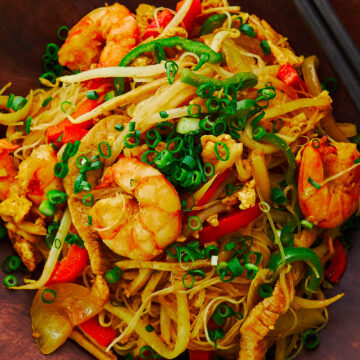 A Chinese-American classic, these "Singapore" Noodles are loaded with shrimp pork and vegetables, stir-fried with curry-flavored rice noodles.