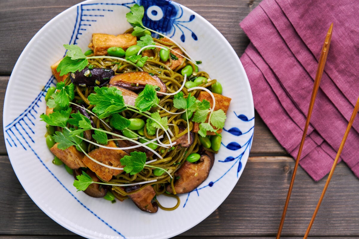 Chilled soba noodle salad with edamame, fried tofu, shiitake mushrooms, and celery sprouts.