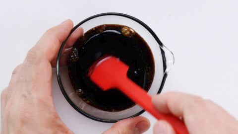 Mixing soba salad dressing.