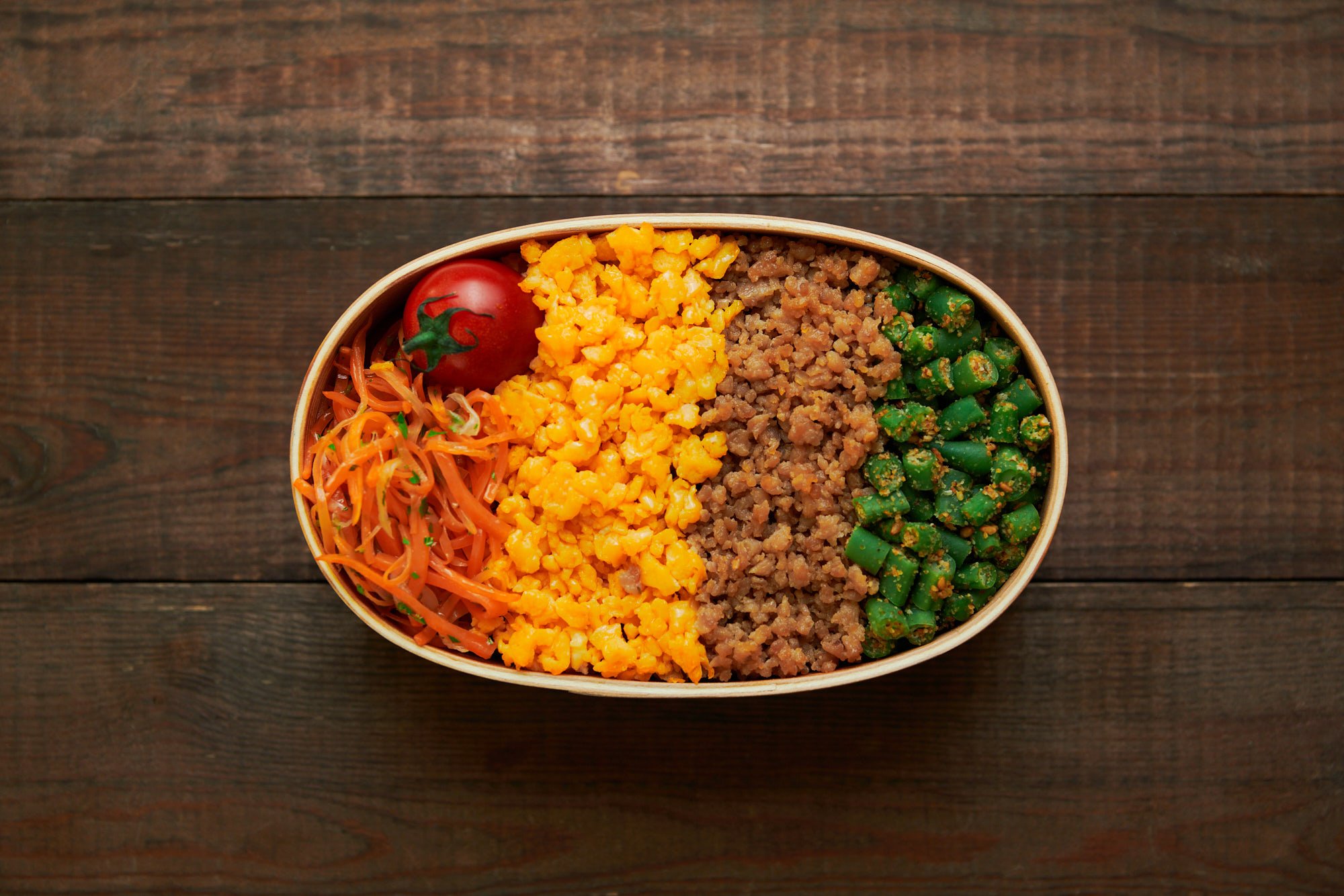 Soboro Don Bento is a rainbow of colors tastes and textures in a portable bento box lunch.