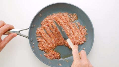 Breaking up ground chicken with a spatula for Soboro.