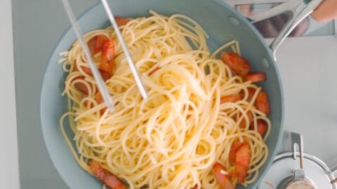 Tossing spaghetti with Guanciale.