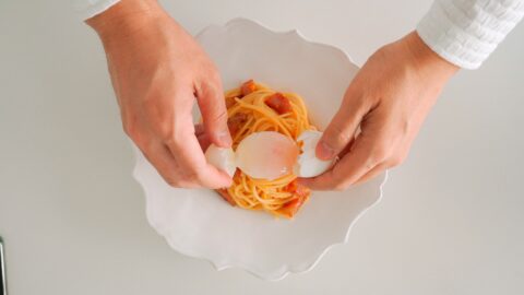 Topping Spaghetti Carbonara with a slow cooked egg.