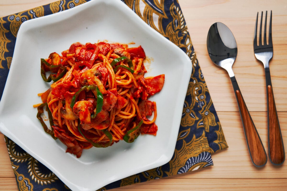 Sweet and tangy Spaghetti Napolitan with bacon, mushrooms and green peppers.