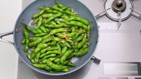 Edamame stir-fried with garlic, chili flakes and black pepper.