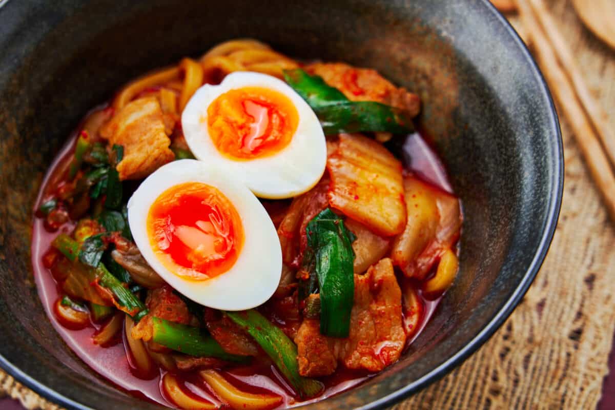 Spicy Kimchi Noodles with pork and a soft boiled egg.