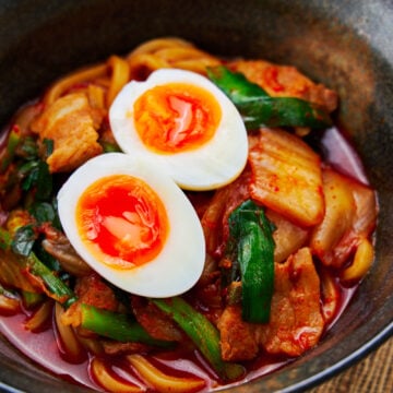 Spicy Kimchi Noodles with pork and a soft boiled egg.