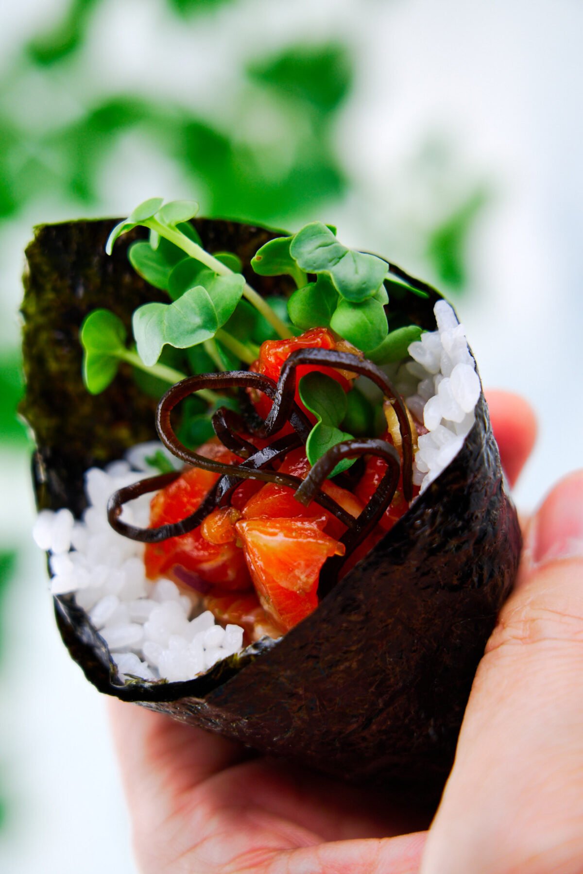 This mouthwatering spicy salmon temaki sushi is rolled in crisp nori and tangy sushi rice and doesn't require any special tools to make.