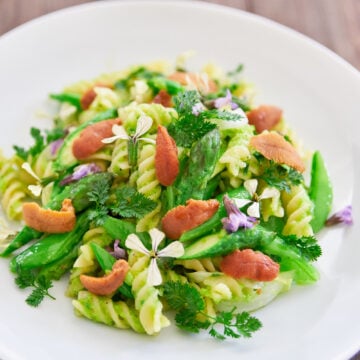 The unbeatable combo of spring veggies with pasta tossed in a creamy green pea pesto makes this drool-worthy spring pasta one of my favorites.