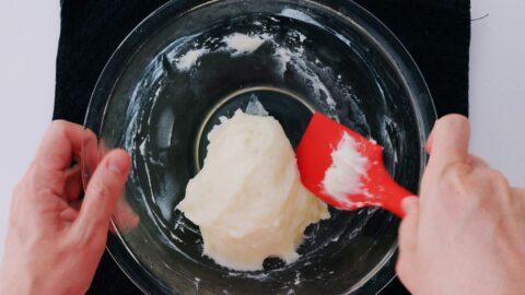 Knead the mochi dough until a smooth elastic ball forms.