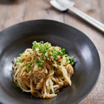 Sukju Namul is an easy Korean bean sprout salad made by blanching mung bean sprouts and seasoning them with sesame oil and garlic.