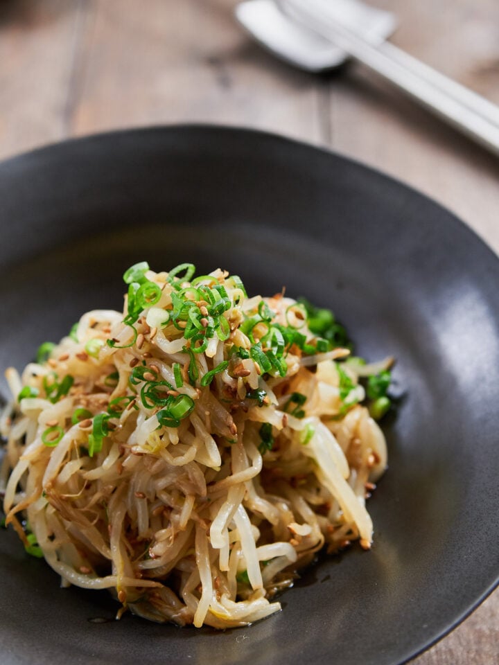 Sukju Namul is an easy Korean bean sprout salad made by blanching mung bean sprouts and seasoning them with sesame oil and garlic.