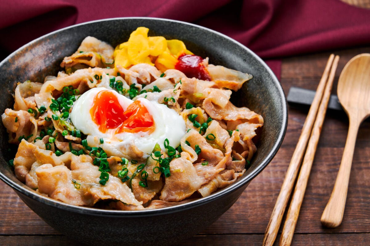 Topped with a silky smooth hot spring egg and glazed in a garlicky sauce, this Sutadon (short for Stamina Donburi) is a mouthwatering version of a Japanese pork bowl.