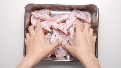 Salting chicken wings removes excess moisture making them easier to crisp.