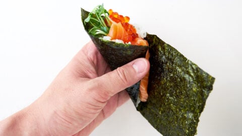 Wrap the nori around to make a cone to finish your temaki sushi.