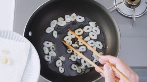 Frying garlic chips in oil.