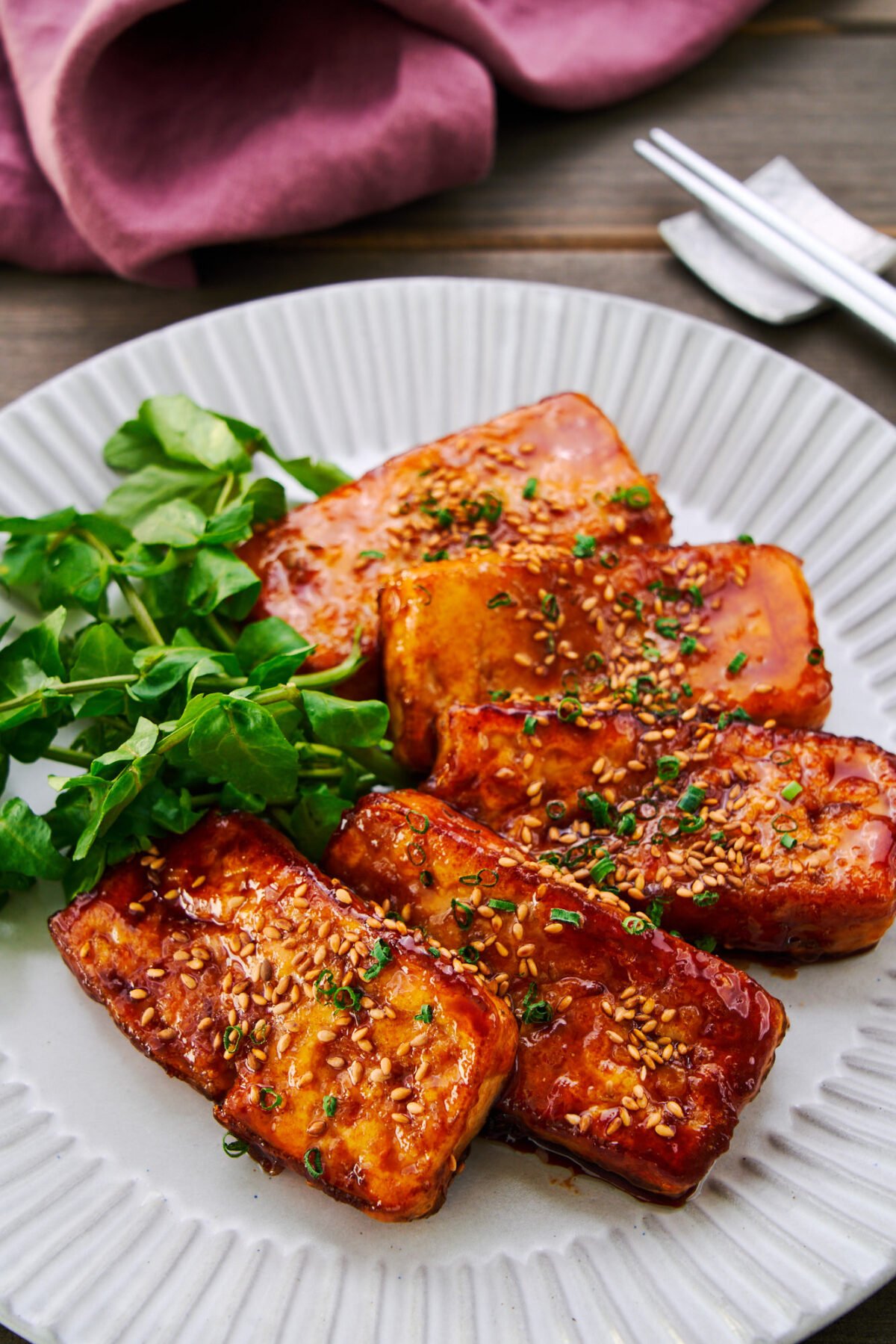 This ginger and garlic infused tofu is pan-fried until crisp before being glazed in caramelized teriyaki sauce.