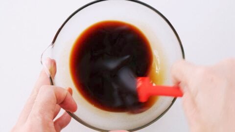 Mixing the sauce for Tonteki in a glass bowl.