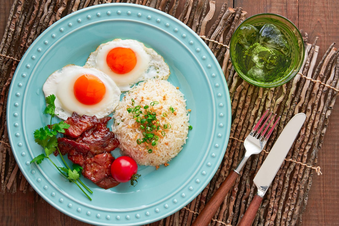 The Best Tosilog Recipe, with home-cured Tocino (Filipino Bacon), Sinangag (garlic fried rice), and sunny side up eggs.